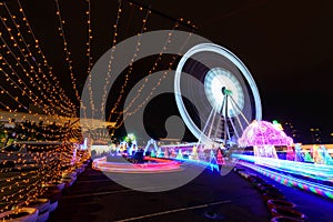 Ferris wheel with lighting at carnival park in night time