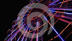 Ferris Wheel with Lights Rotates at Night