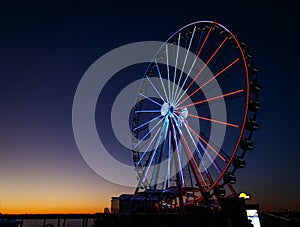 Ferris wheel lit up red, white and blue