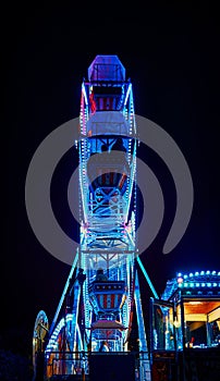 Ferris wheel at night with blue light