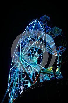 Ferris wheel at night with blue light