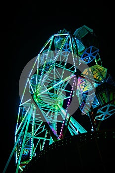 Ferris wheel at night with green light