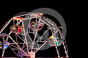 Ferris wheel in a night park.