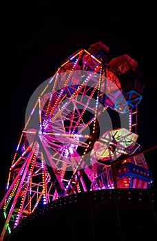 Ferris wheel at night with red light