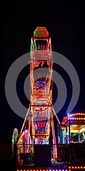 Ferris wheel at night with red light
