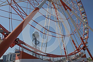 A ferris wheel in the park in Batumi. Brightly colored Ferris wheel against