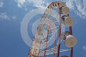 A ferris wheel in the park in Batumi. Brightly colored Ferris wheel against the sky