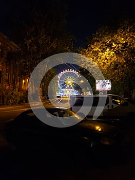 Ferris wheel in park Shevchenko in the evening in Odesa, Ukraine