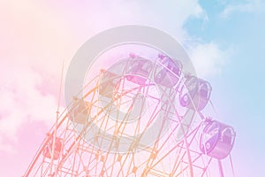 Ferris wheel with pastel sky is perfect for graphics of fun and childhood dreams.