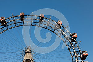 Ferris wheel with red cabines in Prater park, Vienna