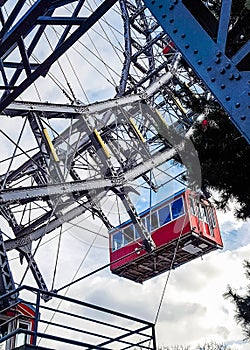 Ferris wheel with red retro cabs in Prater. Vienna Giant Wheel in Amusement Park, Vienna, Austria