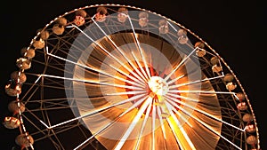 Ferris wheel rotating at night