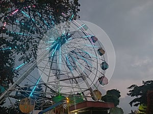 Ferris wheel shining at night in city parkÃ¯Â¿Â¼