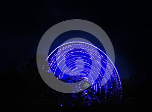 Ferris wheel spinning at night
