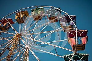 Ferris wheel in street fair with background blue sky at sunset in Hidalgo state