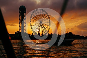 Ferris wheel at sunset near the sea in Batumi.