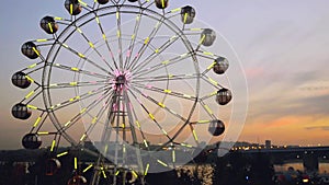 Ferris wheel at sunset on promenade in slowmotion. 1920x1080