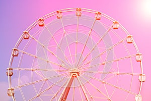 Ferris wheel at sunset during summer at county fair