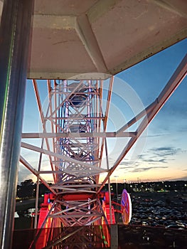 Ferris wheel up close night lights sunset