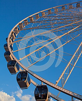 Ferris wheel on the water at sunset