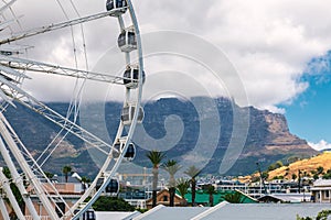 Ferris wheel at Waterfront in Cape Town and Table Mountain