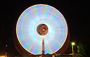 Ferris wheels in motion at night