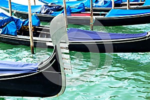 Ferro of gondola docked on the venetian lagoon