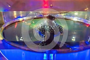 Ferromagnetic fluid magnetized by a magnet in a science museum photo