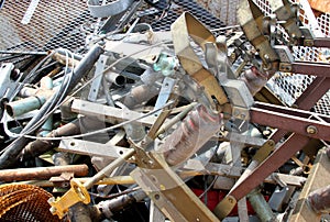 Ferrous material in a container of a controlled discharge