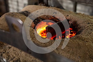 Ferrous metal billet is melted in an induction furnace closeup photo