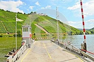 Ferry across the river Moselle to Marienburg Castle near village Puenderich - Moselle wine region in Germany
