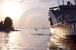 Ferry approching Dalmatian coast on sunset