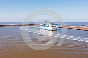 Ferry boat arriving in the harbor from Harlingen in Friesland the Netherlands photo