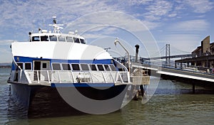 Ferry Boat in Dock and Bay Bridge San Francisco