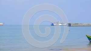 The ferry boat docks at the edge of your Tanjung beach pier