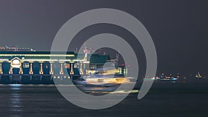 Ferry boat harbor in downtown Hong Kong night timelapse.