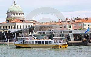 Ferry boat navigates fast on the Venetian lagoon near LIDO DI V photo
