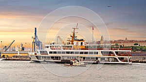 Ferry boat sailing in Marmara sea near Istanbul, against background of Haydarpasa terminal, Kadikoy, Istanbul, Turkey