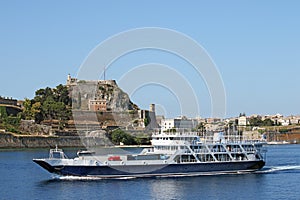 Ferry boat sails close to old fortress Corfu
