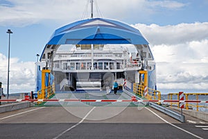 Ferry Boat Ship with open Ramp and empty Car Deck ready to board cars and passengers.