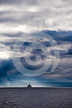 Ferry boat and stormy skies