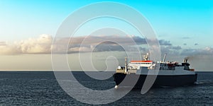 Ferry boat transporting passengers sailing sunrise in Trinidad and Tobago