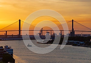 Ferry at Bridge at Sunset