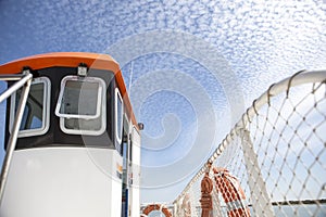 Ferry cockpit with cloud formations in the sky called Altocumulus floccus, Huelva, Spain