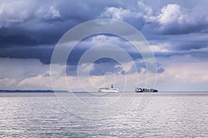 Ferry and container cargo ship on Baltic sea