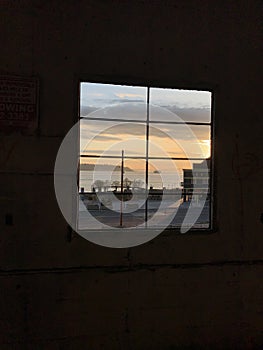 Ferry crossing and Seattle waterfront framed by window.
