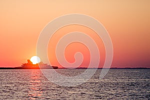 Ferry crossing during sunset