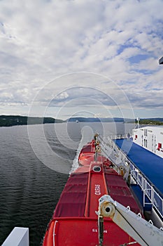 Ferry DFDS MS Crown Seaways Rear view over lifeboats and Fjord coastal landscape
