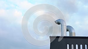 Ferry exhaust pipe smokes black against the sky