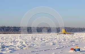 The ferry got stuck in hummocks on a frosty day in the middle of the wide Siberian river